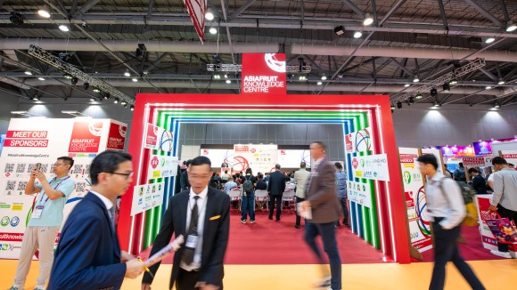 An exhibition hall with moving people.