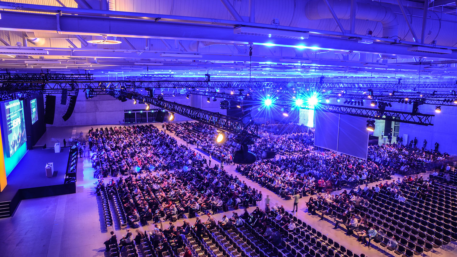 Hall B, row seating, stage, projection screen